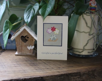 Minimalist cream textured greeting card with colour paper flowers in floral botanical vase Good Luck in your New Home! Floral Housewarming