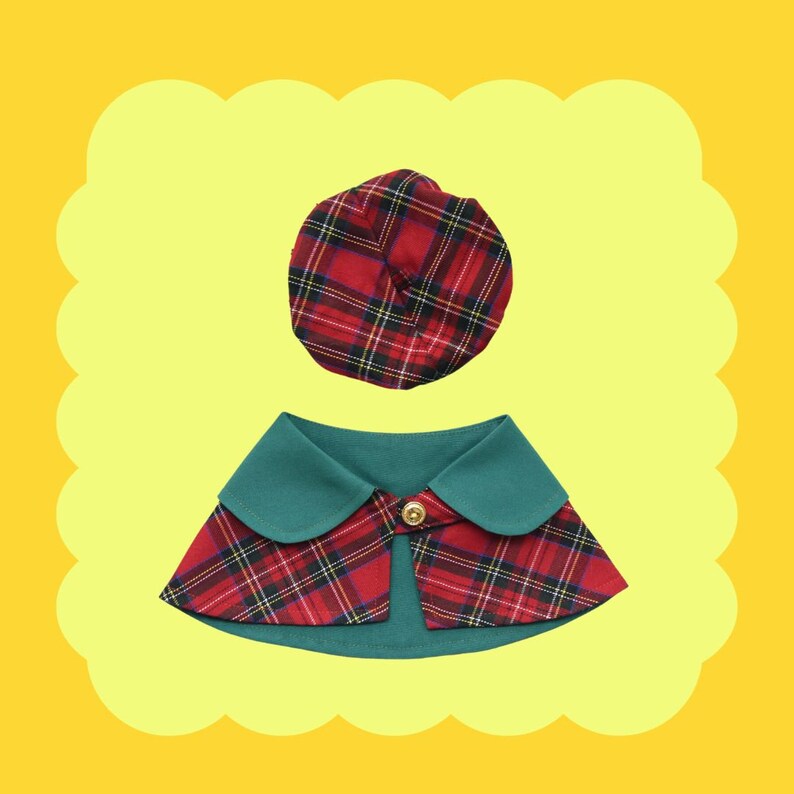 May include: A red and black plaid dog collar with a green collar and a matching red and black plaid hat.