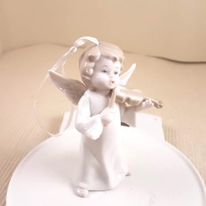Vintage Cherub Figurine angel playing music porcelain