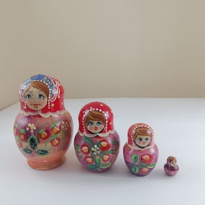 Vintage Matrioshka nesting russian wooden figurine handpainted folklore doll set of four