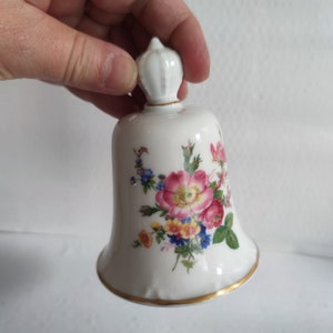 Vintage porcelain bell with painted flowers