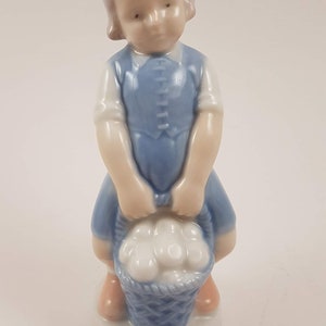 Vintage porcelain girl with basket mini figurine not signed
