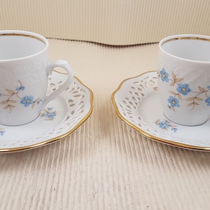 Schumann Arzberg Bavaria porcelain teacup and pierced saucer. Blue and gold flowers. Lace edge, reticulated china. Vintage German ware