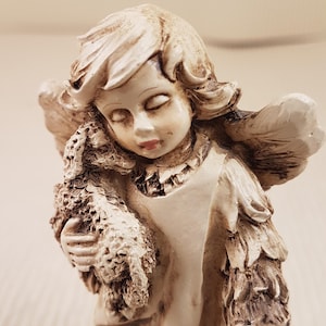 Vintage angel with lamb Figurine stick with crack