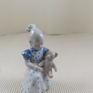 Vintage girl with teddy bear porcelain figurine made in GDR