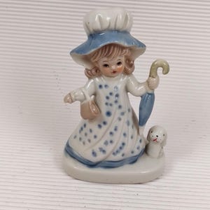 Vintage porcelain girl mini figurine
