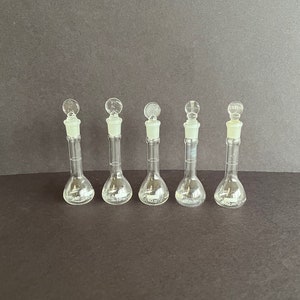 Set of five 10 mL Pyrex glass volumetric flasks with ground glass necks and 4 ground glass stoppers