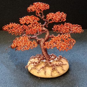 Wire tree sculpture. Handmade bonsai made of colored aluminum wire.