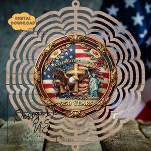 May include: Wooden laser-cut ornament with a central medallion featuring the American flag, an eagle, the Statue of Liberty, and a cross. The text reads "Celebrating America" and "1776-2026 250 Years". The ornament has a decorative floral border.