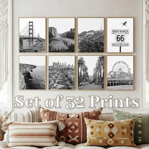 May include: A set of 32 framed black and white prints showcasing Californian landmarks. Images include the Golden Gate Bridge, Yosemite, Hollywood sign, Santa Monica Route 66 sign, coastal views, cityscapes, and a Ferris wheel.