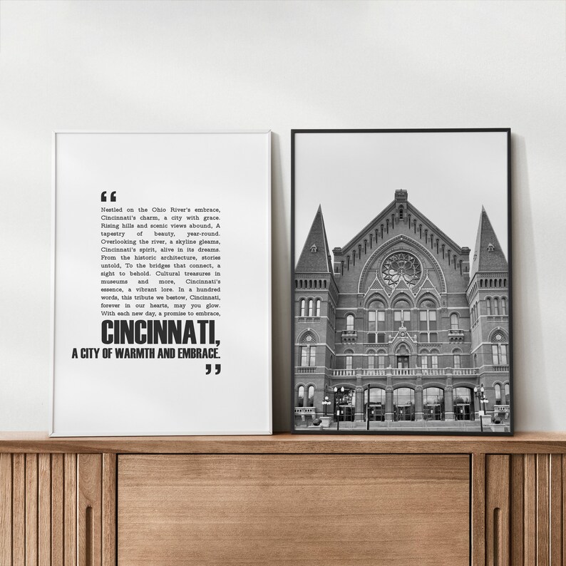 May include: Black and white photo of a building with a quote about Cincinnati, Ohio. The quote reads, "Nestled on the Ohio River's embrace, Cincinnati's charm, a city with grace. Rising hills and scenic views abound, A tapestry of beauty, year-round. Overlooking the river, a skyline gleams, Cincinnati's spirit, alive in its dreams. From the historic architecture, stories untold, To the bridges that connect, a sight to behold. Cultural treasures in museums and more, Cincinnati's essence, a vibrant lore. In a hundred words, this tribute we bestow, Cincinnati, forever in our hearts, may you glow. With each new day, a promise to embrace, CINCINNATI, A CITY OF WARMTH AND EMBRACE."