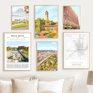 May include: A collection of framed art prints featuring scenes of Spokane, Washington. The prints include images of the city's architecture, a map, and natural landscapes. The frames are a neutral color, and the prints are displayed on a white wall.