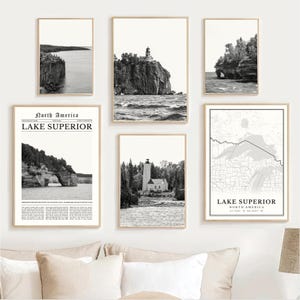 May include: A collection of six framed black and white prints. The prints depict landscapes, including a lighthouse on a cliff, coastal rock formations, and a map of Lake Superior. One print features the text "North America Lake Superior".