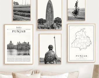 May include: A collection of framed black and white prints featuring scenes from Punjab, India. The images include landscapes, architecture, and historical figures. The prints are displayed on a white wall above a cream-colored sofa.