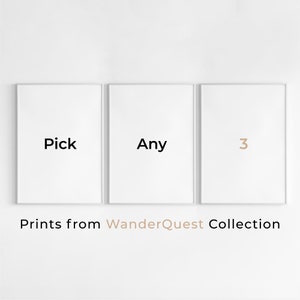 May include: Three white framed prints with black text. The first print says "Pick", the second print says "Any", and the third print says "3". The text "Prints from WanderQuest Collection" is below the prints.