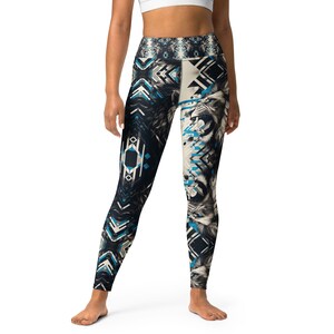 May include: Black and blue patterned leggings with a lion graphic print. The leggings have a high waist and a tight fit.