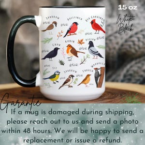May include: White ceramic mug with a black handle. The mug features a colorful illustration of various birds with their names printed below each bird. The text "15 oz White Black" is printed on the top right corner of the mug.