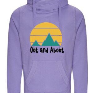 May include: A lilac hoodie with a high collar and a front pocket. It displays a graphic of a yellow sun, teal mountains, and the text "Oot and Aboot" in black.