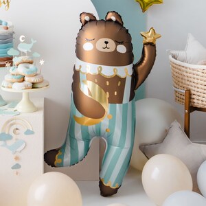 Large teddy bear foil balloon in blue striped pajamas with gold star and moon, baby shower and birthday party decor