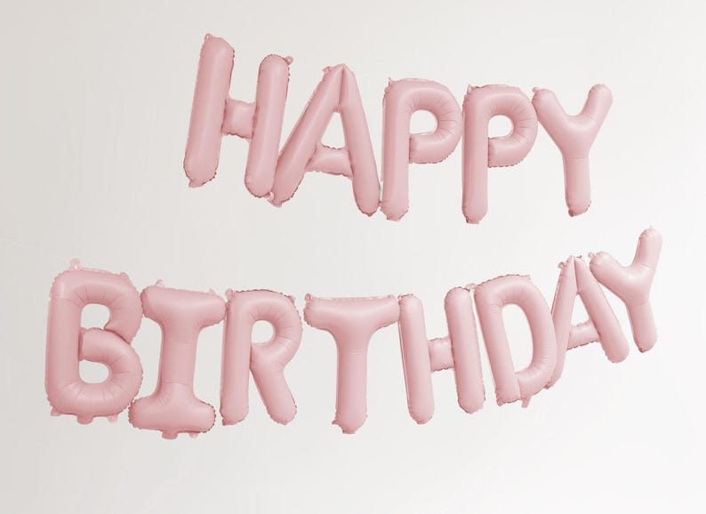 May include: Pink foil balloons spelling out "Happy Birthday" against a white background.