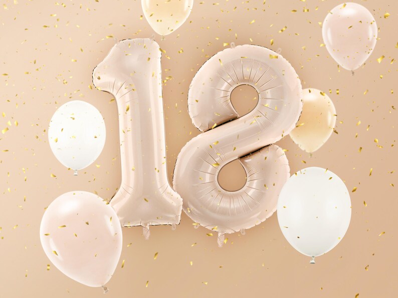 Large beige number balloons forming 18, elegant neutral decoration for an 18th birthday celebration
