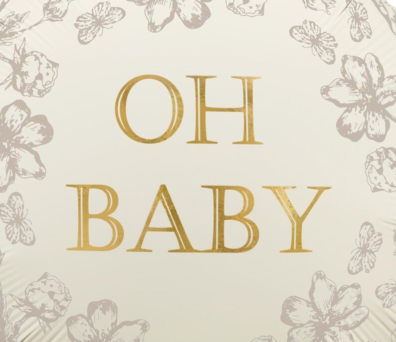 Puede incluir: Un globo color crema con letras doradas que dicen &laquo;OH BABY&raquo;. El globo est&aacute; decorado con ilustraciones florales y de mariposas en un color gris apagado, creando un dise&ntilde;o suave y elegante.