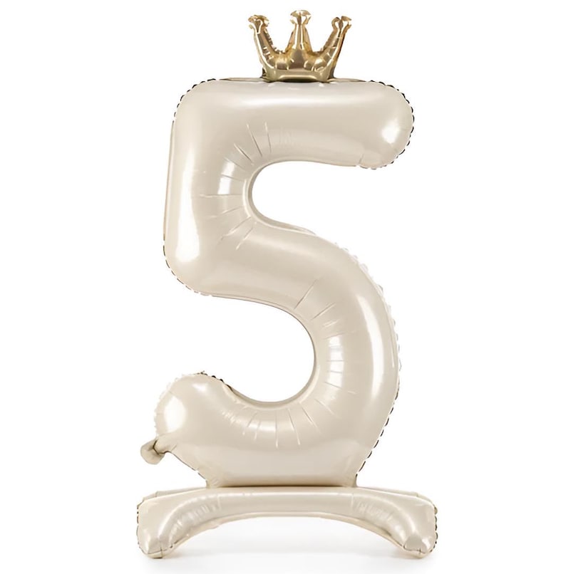 May include: A large, white, number 5 balloon with a gold crown on top. The balloon is standing upright on a white base.