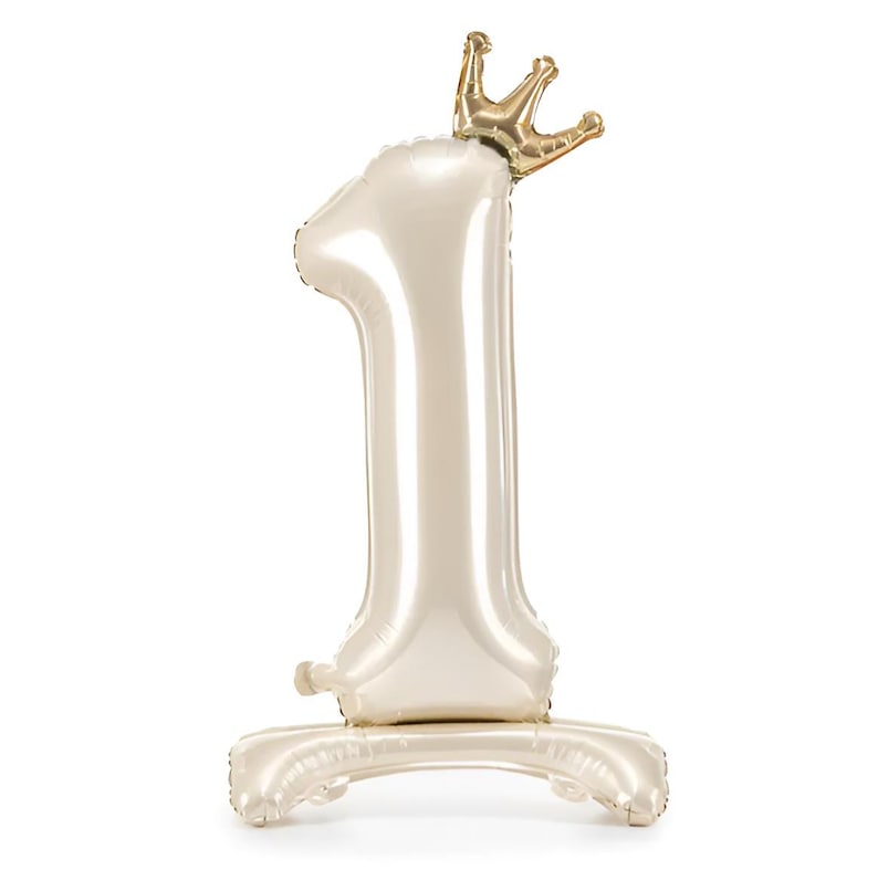 Shiny cream foil balloon shaped like the number one with a small gold crown on top, standing upright on a white background.