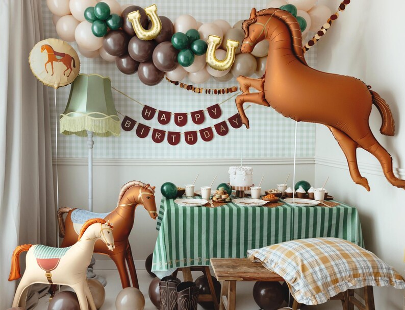 Brown horse foil balloon decorating a cowboy themed party table with western style decorations