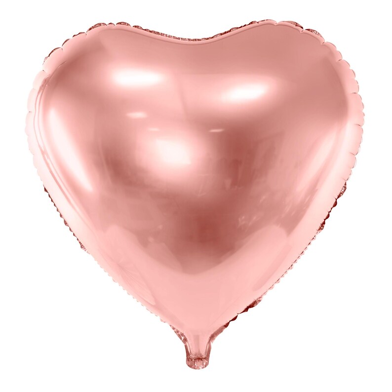 A shiny, rose gold heart-shaped foil balloon isolated on a white background.