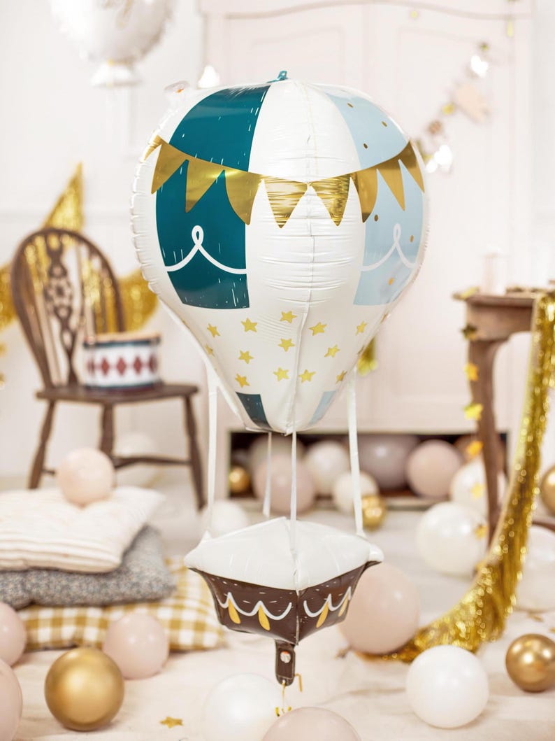 4D hot air balloon foil balloon with gold stars and bunting – baby shower or birthday decoration in nursery setting with pastel and gold balloons
