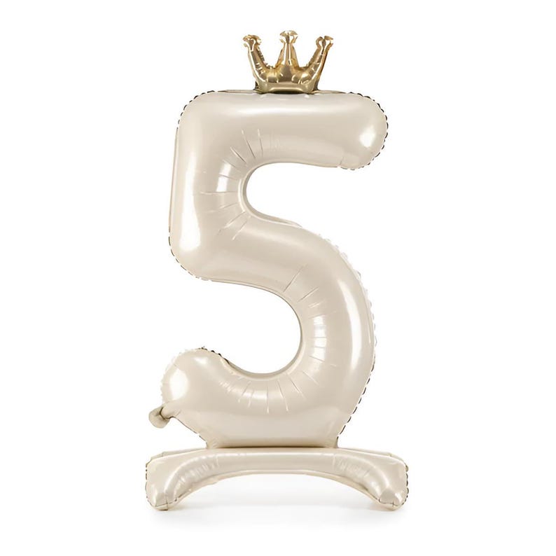 May include: A large, white, inflatable number five with a gold crown on top. The number is standing upright on a white base.