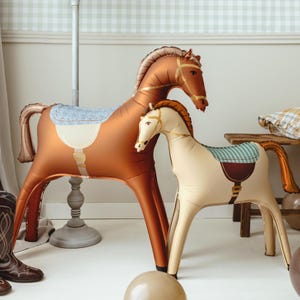 Large brown horse foil balloon displayed in a western inspired room with rustic party decor