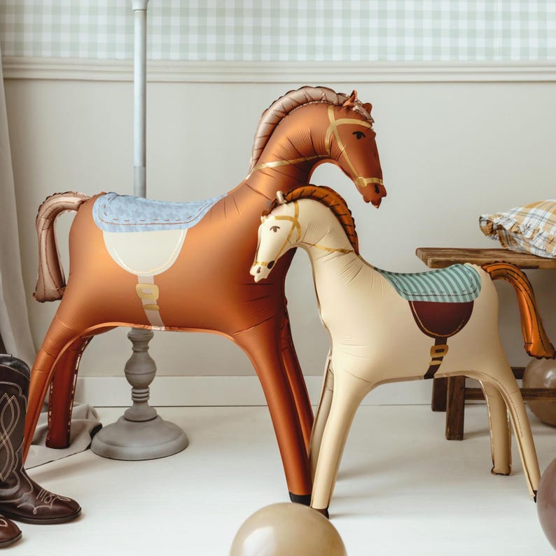 Large brown horse foil balloon displayed in a western inspired room with rustic party decor