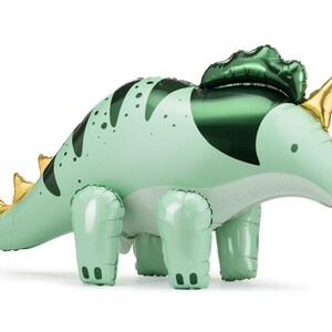 Giant standing dinosaur balloon in green and gold, shaped like a triceratops with 3D legs and horns, perfect for boy's birthday, dino-themed party or baby shower decorations — self-standing foil balloon 36.5 x 19 inches.