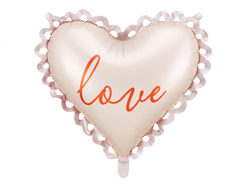 A heart-shaped foil balloon with a soft blush tone and decorative scalloped edges. The word "love" is written in elegant red script across the center. The balloon is isolated on a white background, perfect for romantic or celebratory occasions.