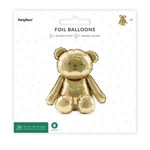 May include: A gold foil balloon in the shape of a teddy bear, packaged on a white background. The package reads "FOIL BALLOONS" and includes measurements of 17" x 21" and 15" x 16.5". The balloon is a party decoration.