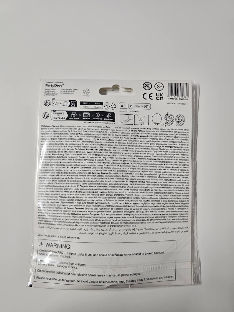 May include: A warning label for a package of balloons. The label is printed in multiple languages and includes safety information about choking hazards, suffocation, and electric power lines. The label also states that colors may stain or bleed when wet.