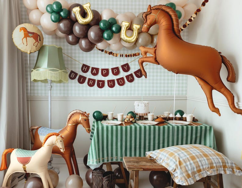 Galloping horse foil balloon with western party table decor for cowboy or horse themed celebration