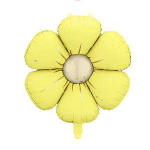 May include: A large, yellow flower-shaped balloon with a light gold center. The balloon has six petals and a small, rounded tail. The petals have subtle gold accents and small, round details. The balloon is designed to look like a sunflower.