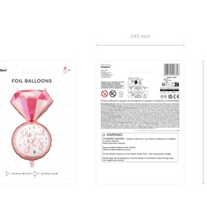 May include: Pink foil balloon shaped like a diamond ring with the words "She said yes" on the band. The balloon is 14.5 inches wide and 20 inches tall.