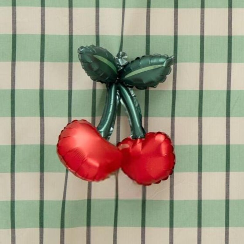 Cherry-shaped foil balloon with vibrant red cherries and shiny green stems and leaves – perfect party decoration for birthdays, summer events, fruit themes, and fun photo backdrops.
