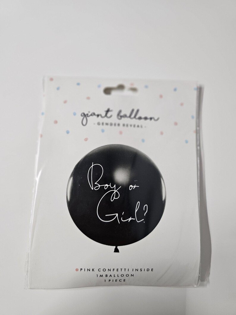 May include: Black gender reveal balloon with white text that says "Boy or Girl?" and pink confetti inside.  Giant balloon, 1 piece.