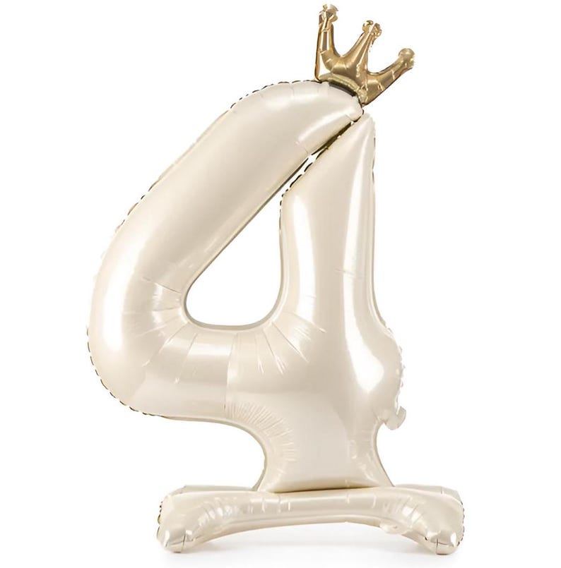 May include: A white number four balloon with a gold crown on top. The balloon is standing on a white base.