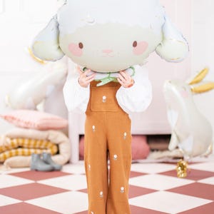 Large sheep foil balloon shown with a child for size reference, approx. 26 x 15.5 inches inflated, cute birthday party decor