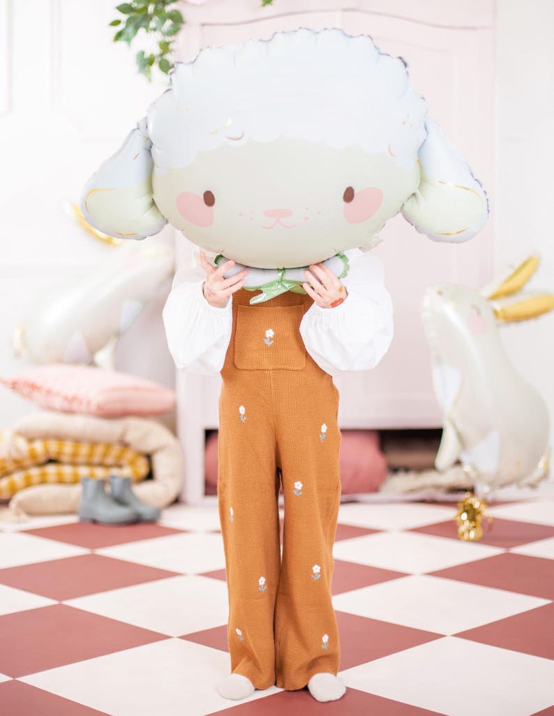 Large sheep foil balloon shown with a child for size reference, approx. 26 x 15.5 inches inflated, cute birthday party decor