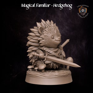 May include: A brown, 3D printed miniature of a hedgehog wearing armor and holding a sword. The hedgehog is standing on a base with mushrooms. The miniature is titled "Magical Familiar - Hedgehog" and is for players by players.