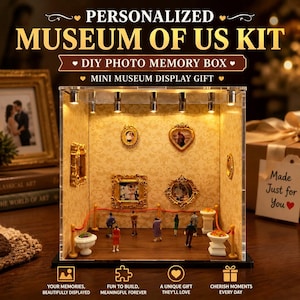 May include: A clear acrylic display box containing a miniature museum diorama with beige patterned wallpaper, wooden flooring, and gold-toned picture frames. The kit includes small figurines, red velvet-style ropes, and integrated LED spotlights.