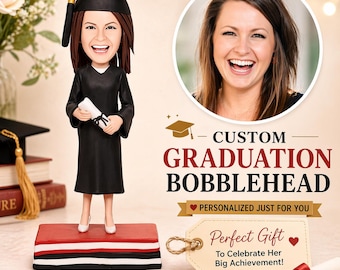 May include: A custom graduation bobblehead of a smiling graduate in a black gown and cap, holding a diploma. The bobblehead stands on a red, white, and black base. The image includes the text "CUSTOM GRADUATION BOBBLEHEAD".