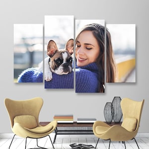 May include: A four-panel canvas print featuring a woman and a French Bulldog. The dog has brown and white markings and is resting on the woman's shoulder. The woman is wearing a blue sweater. The background is blurred.